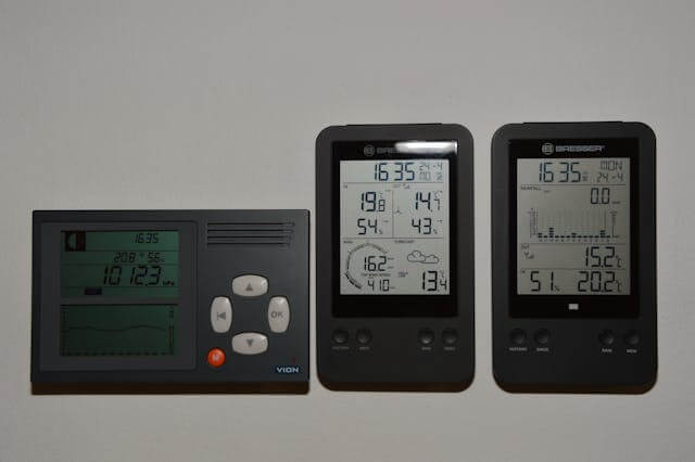 Smart indoor temperature controller displaying digital readings, symbolizing smart home climate monitoring technology.