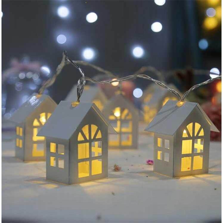 wooden house warm light christmas garland